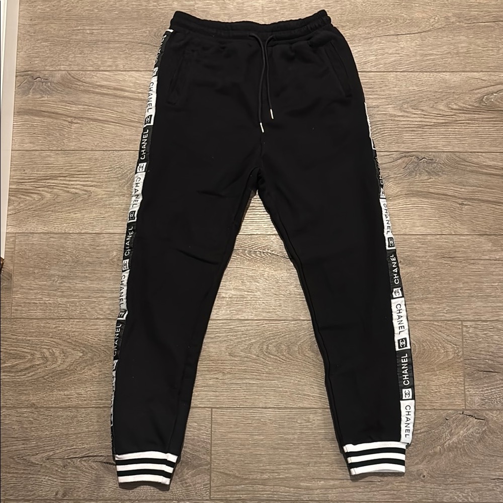 CHANEL Black Joggers with White Logo Stripes